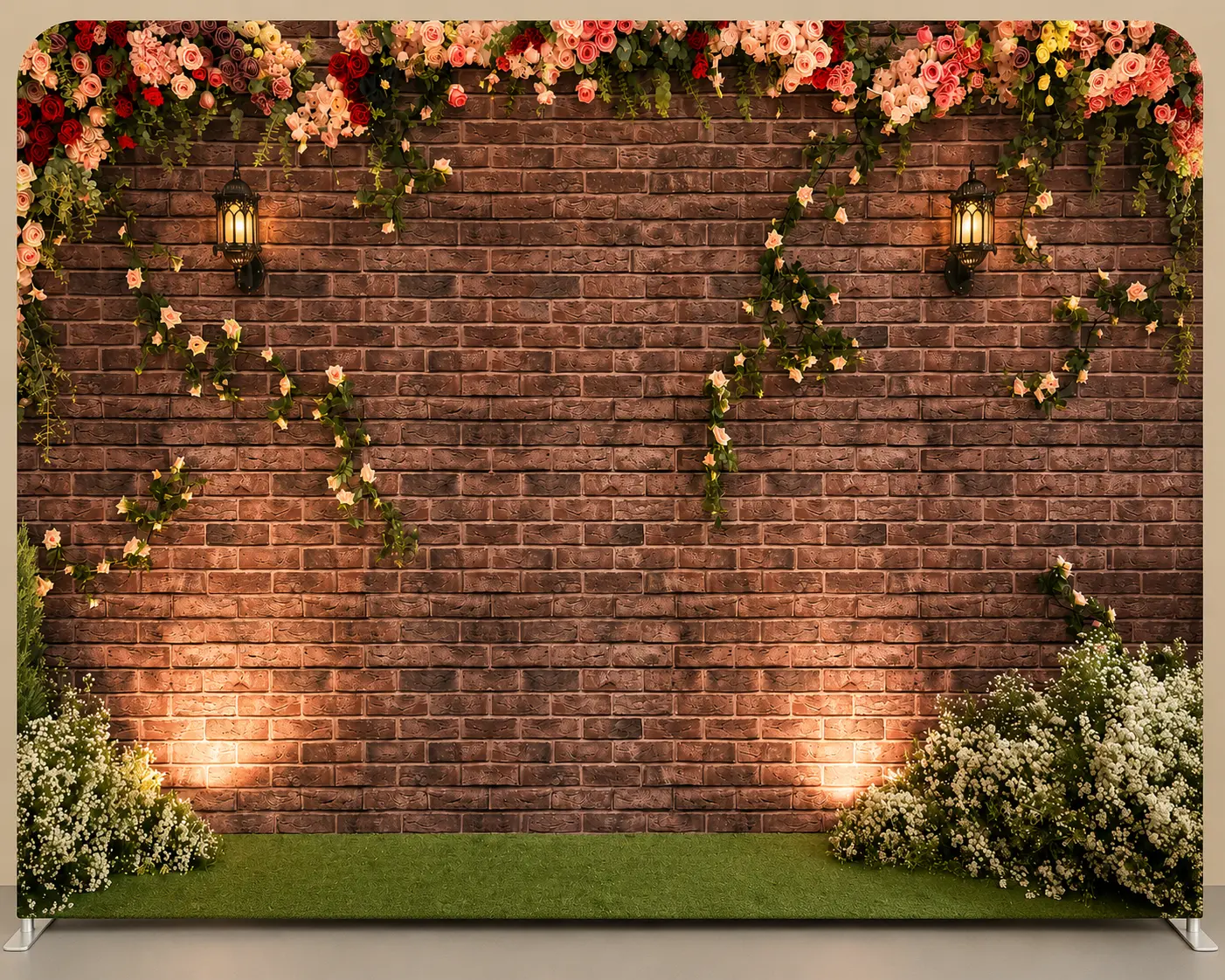 Rustic brick wall backdrop wrapped in roses, lanterns and greenery